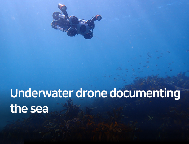 Underwater drone documenting the sea image